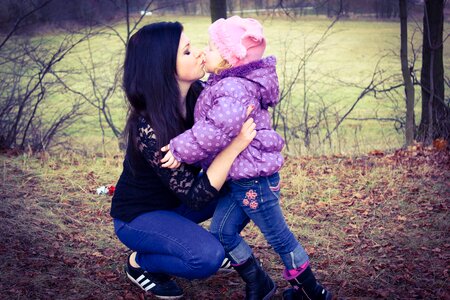 Child embrace kiss