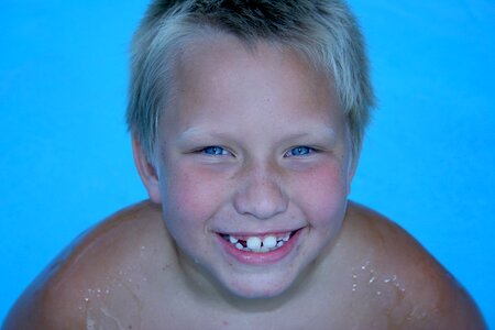 Laughing kid swimming photo