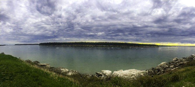 Panoramic of the Mackenzie river landscape under clouds photo
