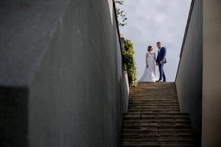 Groom bride stairs photo