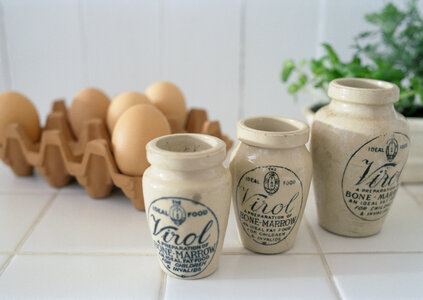 Old ceramic jug on the vintage table photo