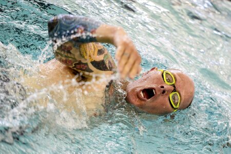 Young man swimming the front crawl photo