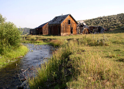 Homestead next to a creek landscape photo
