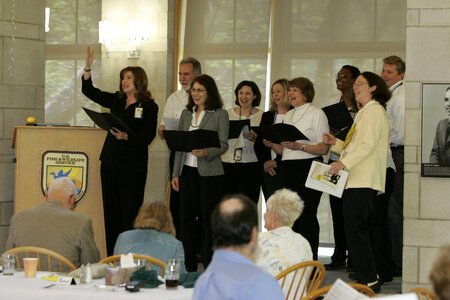 Laura Jones with group singing to Rick Lemon
