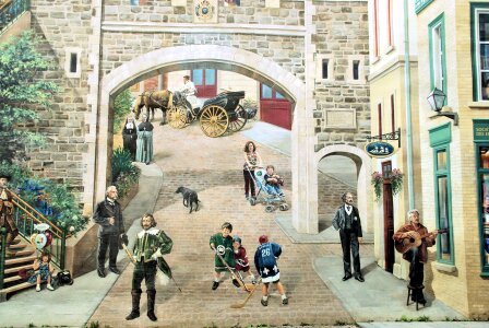 Tourists stroll amoung the shops at Place Royale in Old Quebec photo