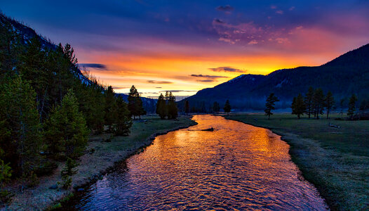 Sunset over the river in Yellowstone National Park, Wyoming photo