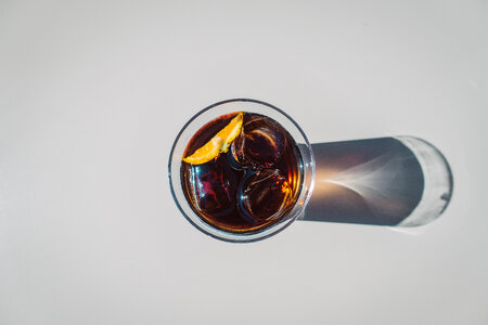 Cola in Glass with Ice Top View photo