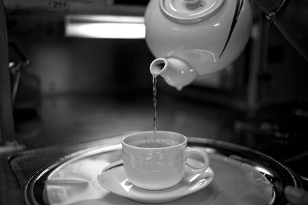 Pouring saucer teapot photo