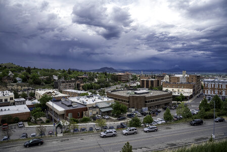 Town of Helena under heavy clouds with mountains in the background