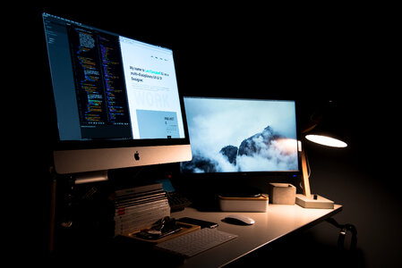 Designing on iMac in a Dark Office photo