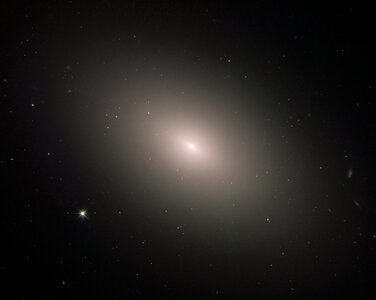 This luminous orb is the galaxy NGC 4621 photo