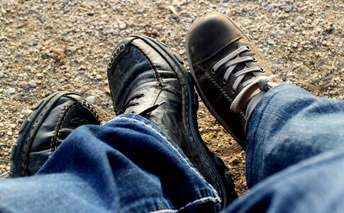 Feet different shoelaces photo