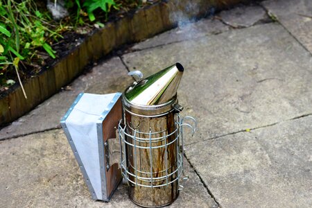 Metal fire-pot nozzle smoke photo