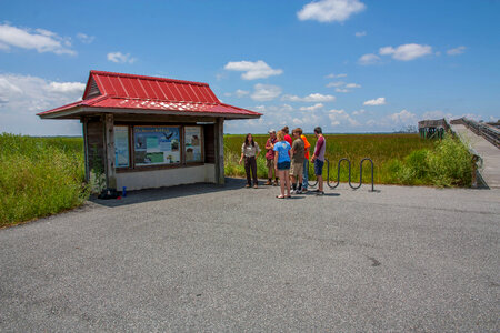 FWS staff talks to group of high school students at kiosk-6