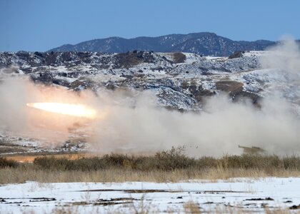 Soldiers fire a rocket photo