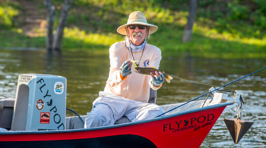 Angler with Rainbow trout on White River-1 photo