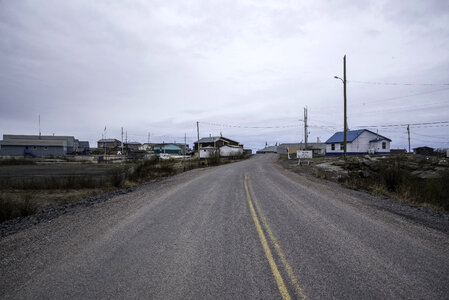 Road into Dettah under cloudy skies on the Ingraham Trail