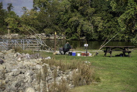 Man sitting on the Bank fishing on the Wisconsin River photo