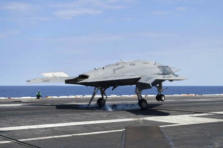 The Navy's unmanned X-47B lands aboard photo