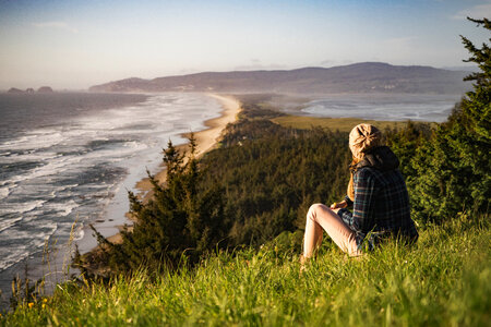 Girl looking at the coastline landscape photo