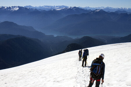 Hiking and climbing in the snow landscape on Mount Baker photo