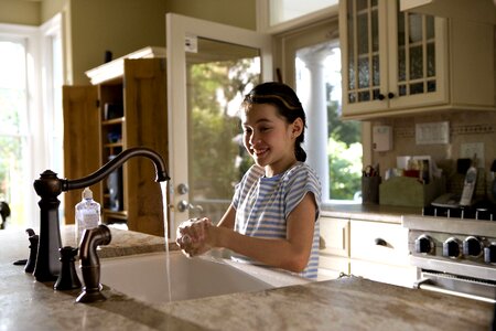 Boiling female child hands photo