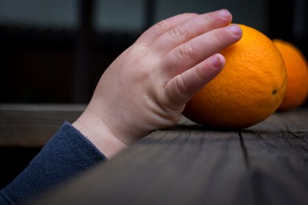 Orange child reaching