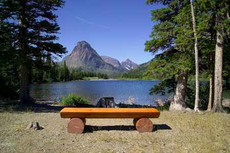 Bench viewing the wilderness landscape at Glacier National Park, Montana photo