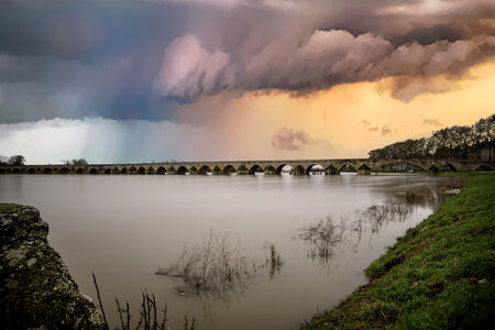 Storm clouds over the dusk lake landscape photo