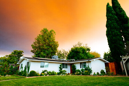 Sunset over a Single-Storey House in Suburbs photo