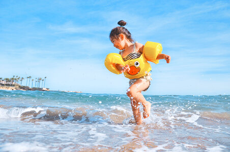 Happy Kid Girl Running the Summer Beach photo