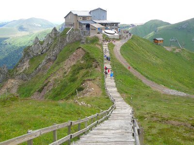 Wooden hiking path to the mountain photo