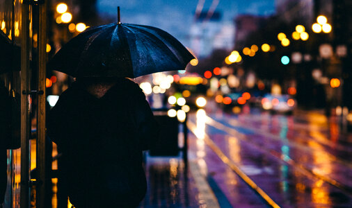 Person under Umbrella in the Evening City photo