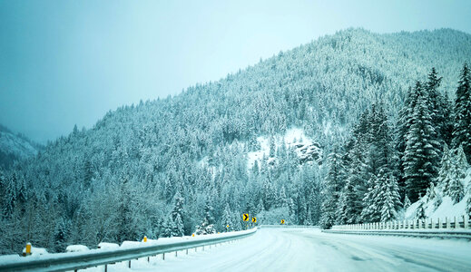 Snowy morning on the road in the hills landscape at Idaho Falls photo