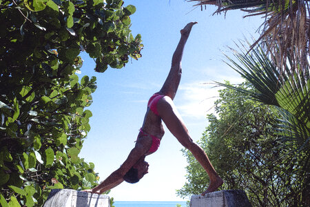 Beautiful and Athletic Young Woman Exercises Outdoors photo