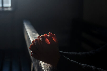 Hands Praying in Church photo