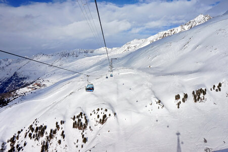 Ski Lifts on the snowy mountain side photo