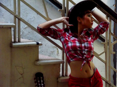 Asian female model in cowboy outfit photo