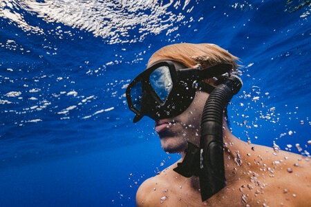 Man with Mask Diving in Clear Water photo