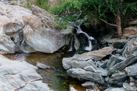 Delicate Waterfall Beside Rocky Stream photo