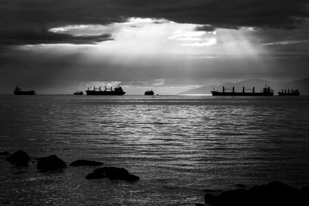 Light on the ocean with ships in Vancouver, British Columbia, Canada photo