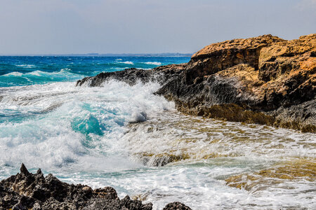 Waves Crashing on the Rocky Shoreline photo