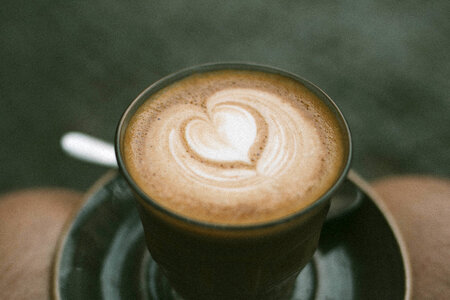 Top View of Hot Cappuccino Coffee with Latte Art Heart Shape photo