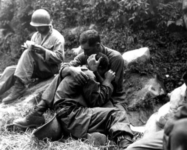 G.I. comforting a grieving infantryman in Korean War photo