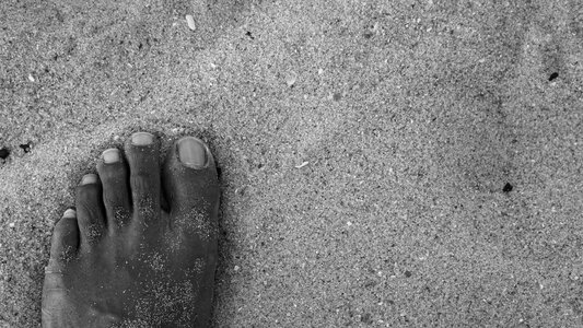 Foot toes sand