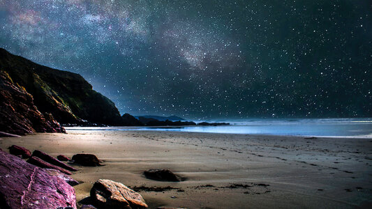 Stars in the night sky on the beach photo