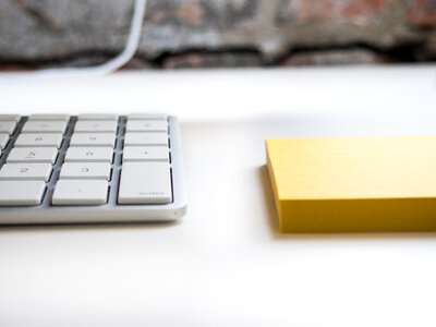 Desk with Keyboard and Notepad