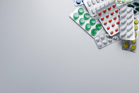 Medicine pills in packs. Full screen background photo