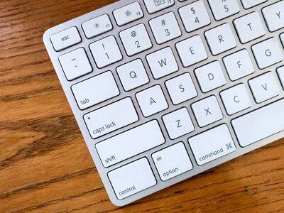 Keyboard on Wood Desk photo