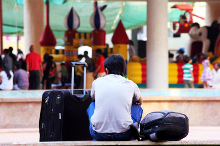 Traveller Waiting With Luggage photo